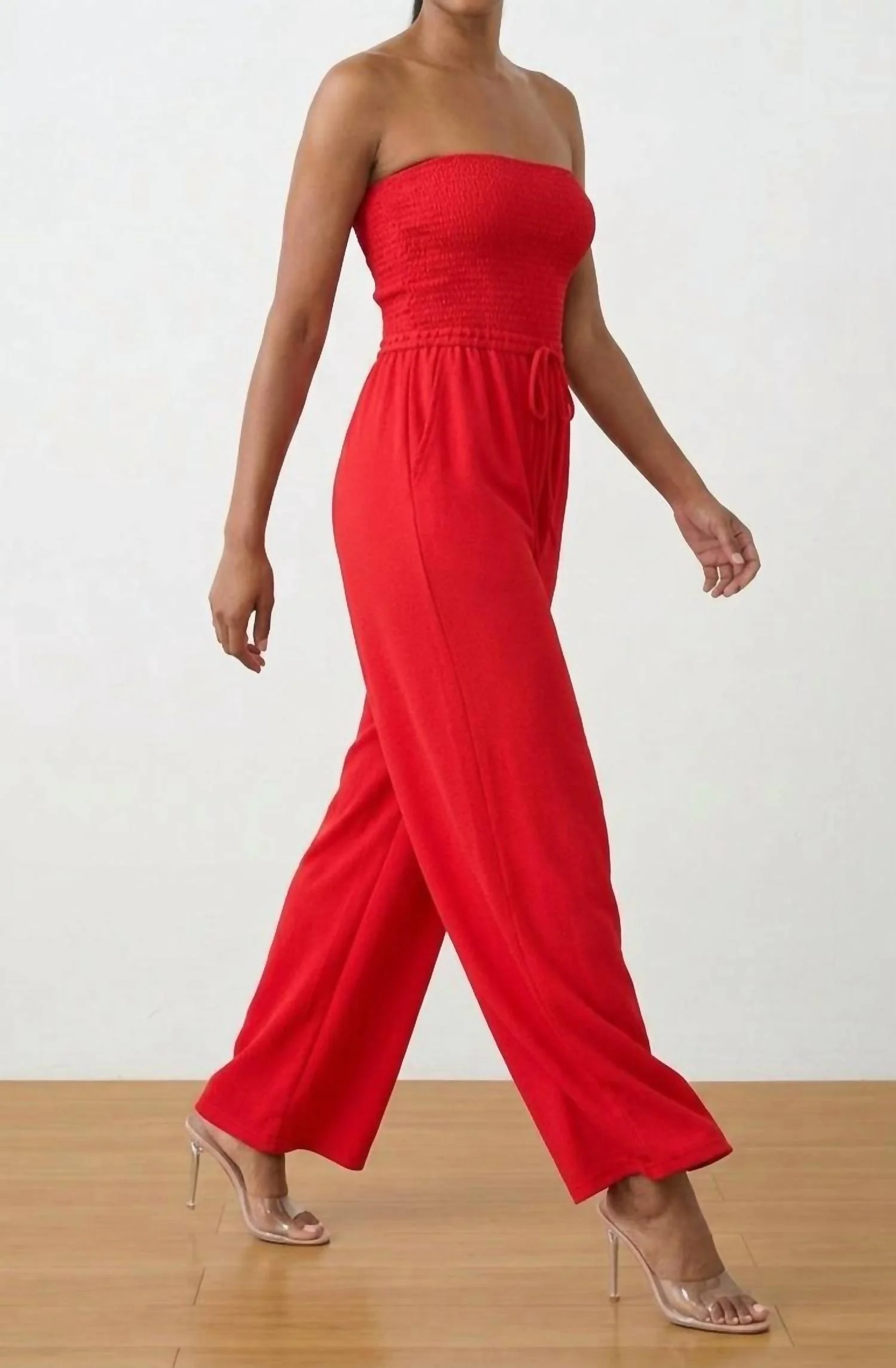 Strapless Smocked Jumpsuit In Ruby